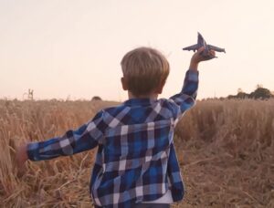 kid running in field